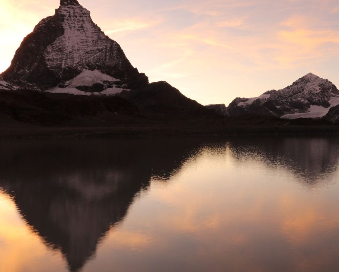 Matterhorn reflected in Lake Riffelsee at sunset, Swiss Alps